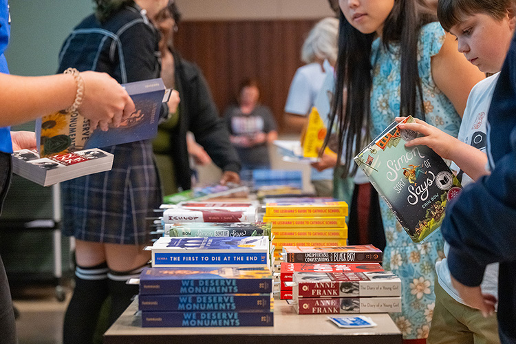 Attendees browse through the selection of free books available at the “Let Freedom READ” book banning awareness event held Wednesday, Sep. 25, at the College of Education Build-ing on the Middle Tennessee State University campus in Murfreesboro, Tenn. (MTSU photo by Cat Curtis Murphy)