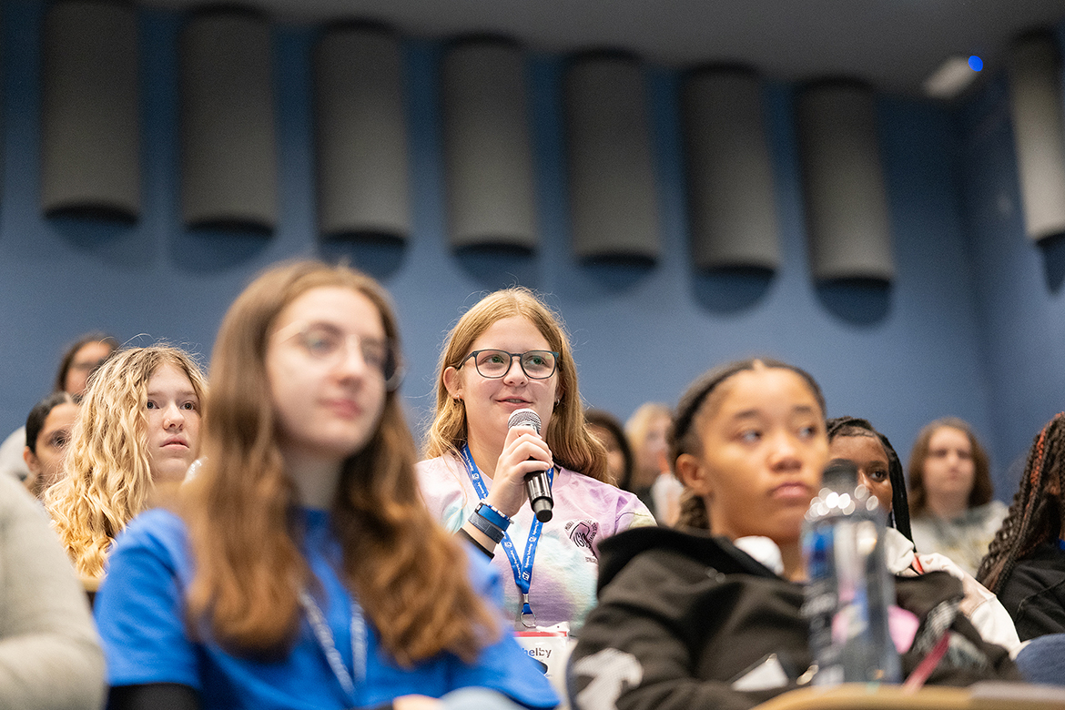 A student attending the 28th annual Tennessee Girls in STEM Conference at Middle Tennessee State University in Murfreesboro, Tenn., Saturday, Oct. 19, poses a question to guest speaker Emily Oppmann, of Washington, D.C., an MTSU alumna and genetic counselor with Inova. There were so many great questions. They showed a high level of interest,” Oppmann said. (MTSU photo by Cat Curtis Murphy)