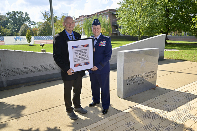 Retired Army Lt. Gen. Keith Huber, left, MTSU’s senior adviser for veterans and leadership initiatives, presents Maj. Gen. Regena Aye, Civil Air Patrol’s national commander, with a rendering of a brick to be installed in her honor at MTSU’s Veterans Memorial on the west side of campus in Murfreesboro, Tenn. (MTSU photo by Andy Heidt)