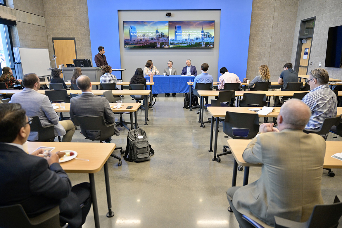 Middle Tennessee State University’s Jennings and Rebecca Jones Chair of Excellence in Urban and Regional Planning Scholars Program students, faculty mentors and staff listen to local leaders at the Oct. 25 sustainability, mobility and livability panel discussion at the School of Concrete and Construction Management Building on campus in Murfreesboro, Tennessee. Sitting at the front of the classroom, from left, are panelists Shelly Hazle, Alan Thompson and Andy Lucyshyn. Standing at left is moderator Ugur Orak, associate professor in the Department of Sociology and Anthropology. (MTSU photo by Andy Heidt)