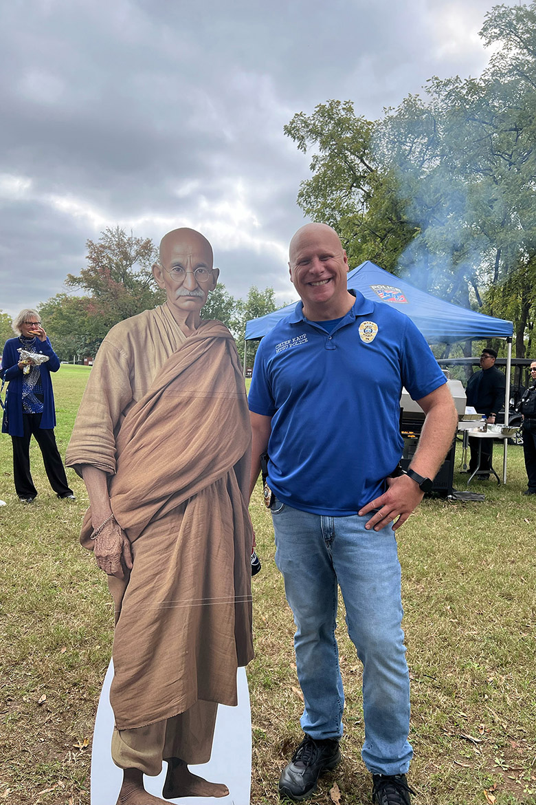 Middle Tennessee State University Police Department’s Chief Edwin “Ed” Kaup poses with a life-size cutout of the late peace advocate Mahatma Gandhi at the annual International Day of Nonviolence event to reaffirm the True Blue Pledge of committing to reason and not violence as well as celebrating Gandhi’s birthday on Wednesday Oct. 2, in Walnut Grove in Murfreesboro, Tenn. (Photo submitted)