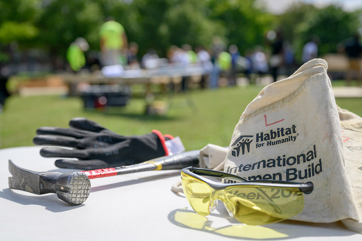 A hammer, glove, tool belt and safety glasses sit on a table at the annual Habitat for Humanity panel build on Thursday, Oct. 3, in the Student Union Commons in Murfreesboro, Tenn. (MTSU photo by J. Intintoli)