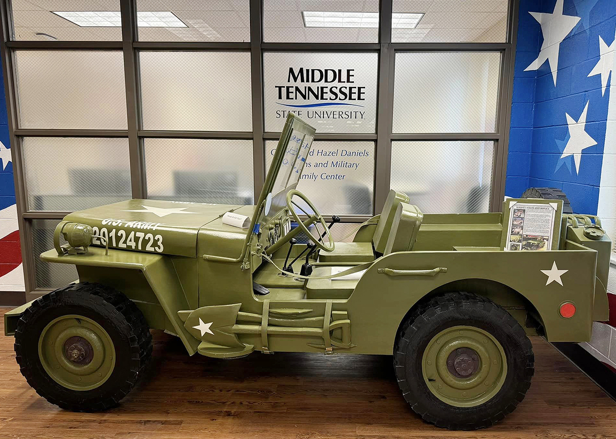 Attendees at the Borderless Arts Tennessee USO-Inspired Show — set for 6 p.m. Saturday, Oct. 19, in Keathley University Center Theater, 1524 Military Memorial on the campus of Middle Tennessee State University in Murfreesboro, Tenn. — can pose with a cardboard replica of a WWII-era Jeep donated by Monteagle, Tennessee-based Werner Military Museum. The Jeep will be displayd next to a glass case near Dwight's Mini Mart on the KUC's second floor and remain there through Saturday, Nov. 9, for events surrounding the 42nd annual Salute to Veterans and Armed Forces game activities starting with the Veterans Memorial Service at 8:30 a.m. in the KUC Theater. (Submitted photo)