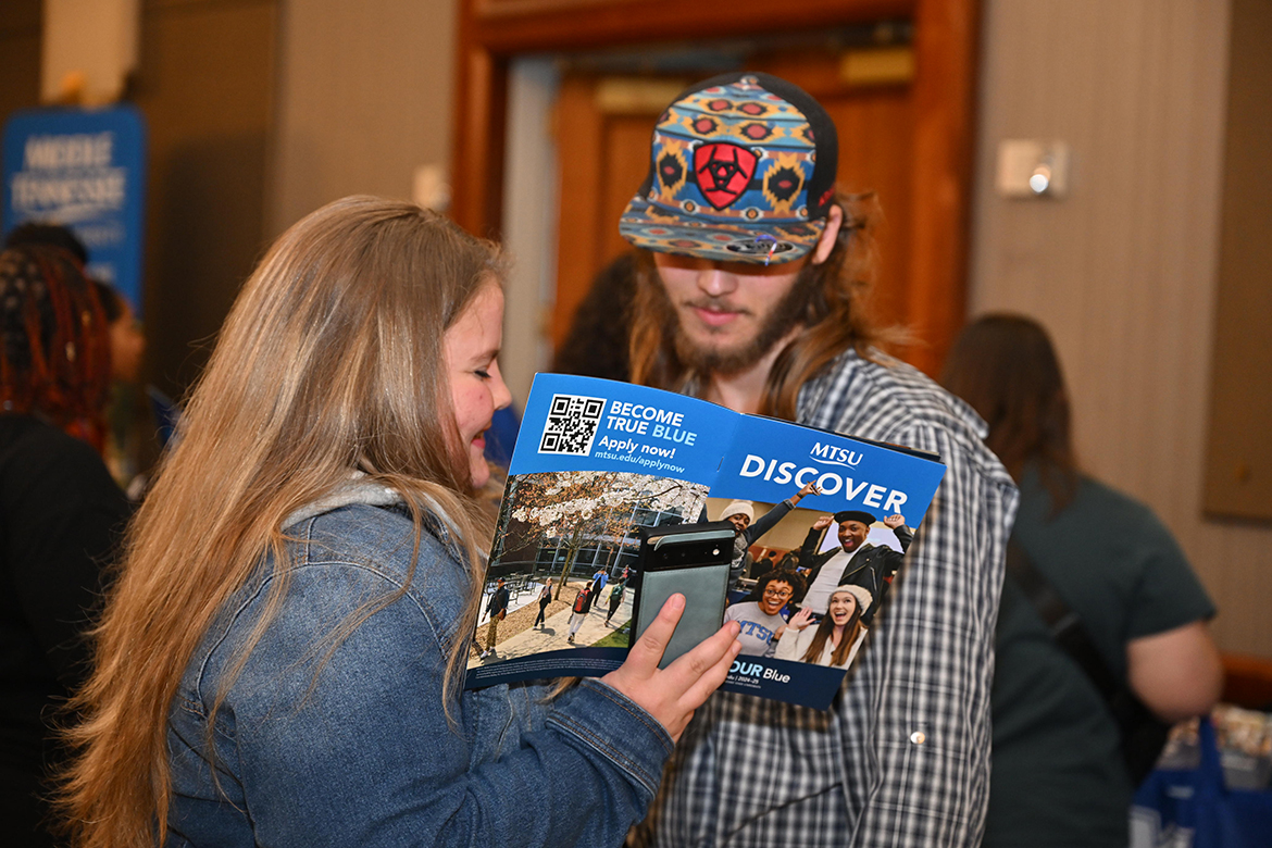 Prospective Middle Tennessee State University students discover all that the university has to offer while browsing through the Office of Admissions “Discover” publication Tuesday, Oct. 22, during the annual True Blue Tour visit to The Chattanoogan Hotel in Chattanooga, Tenn. More than 100 students attended the event. (MTSU photo by James Cessna)