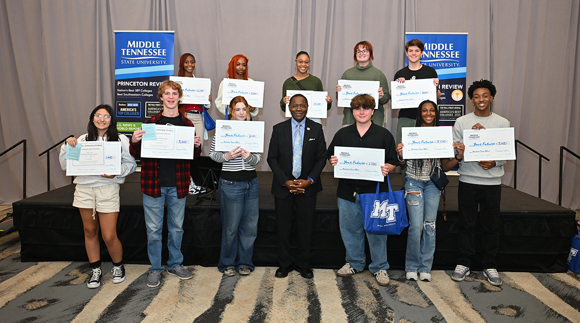 Eleven of 13 scholarship recipients from the Chattanooga, Tenn., area are shown with Middle Tennessee State University President Sidney A. McPhee, front row center, on Tuesday, Oct. 22, during the MTSU True Blue Tour visit at The Chattanoogan Hotel. (MTSU photo by James Cessna)