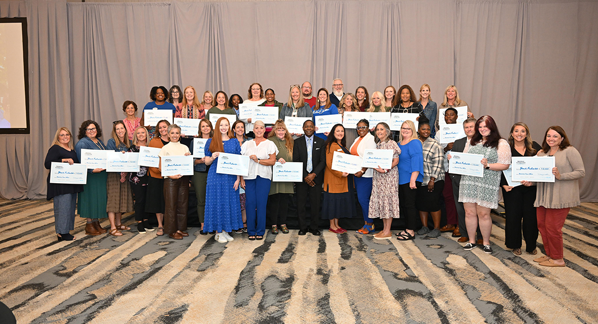 Middle Tennessee State University presented a combined 40 high school counselors and representatives from Cleveland and Chattanooga State community colleges $2,500 scholarships to award to their students for the 2025-26 MTSU academic year Tuesday, Oct. 22, during the MTSU True Blue Tour visit at The Chattanoogan Hotel. They are shown with President Sidney A. McPhee, front row, center. (MTSU photo by James Cessna)