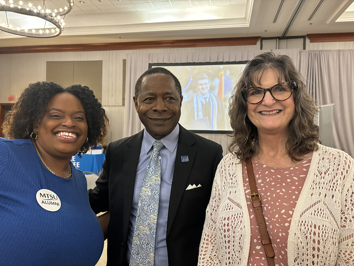 Chattanooga High School Center for Creative Arts counselor (and MTSU alumna) Freda McCray, left, and college and career counselor Melissa Sarabia, right, join Middle Tennessee State University President Sidney A. McPhee shortly after he presented them with a $5,000 scholarship for their students as part of the recent True Blue Tour luncheon for counselors and community college staff and evening student reception at The Chattanoogan Hotel in Chattanooga, Tenn. The school sent nearly 15 of its 2024 graduates to MTSU, to which he said, “We appreciate it. Keep up the good work.” (MTSU photo by Randy Weiler)