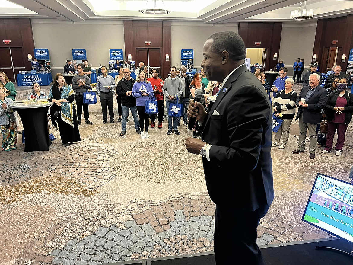 Middle Tennessee State University President Sidney A. McPhee, foreground, makes points about MTSU’s many offerings — caring faculty and staff, quality programs, national rankings and more — while speaking to those who attended the Thursday, Oct. 17, True Blue Tour recruiting event at The Westin Huntsville in Huntsville, Ala. Ten students left with $3,000 scholarships by night’s end. (MTSU photo by Andrew Oppmann)