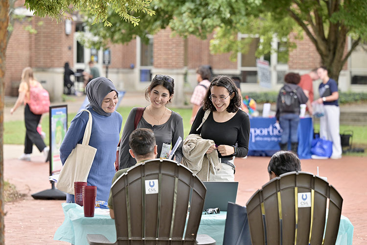 A trio of Middle Tennessee State University students stop by one of the information tables set up by area nonprofit organizations about volunteer opportunities during the fall Volunteer Fair held Tuesday, Oct. 1, near the Student Union Commons on the MTSU campus in Murfreesboro, Tenn. (MTSU photo by J. Intintoli)