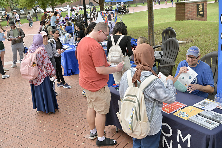 Middle Tennessee State University students stop by the various information tables set up by area nonprofit organizations about volunteer opportunities during the fall Volunteer Fair held Tuesday, Oct. 1, near the Student Union Commons on the MTSU campus in Murfreesboro, Tenn. (MTSU photo by J. Intintoli)