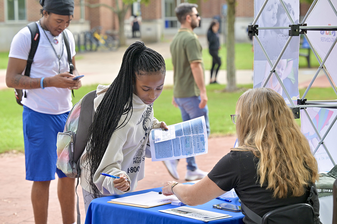 A Middle Tennessee State University student speaks with a representative from the Special Kids about volunteer opportunities during the fall Volunteer Fair held Tuesday, Oct. 1, near the Student Union Commons on the MTSU campus in Murfreesboro, Tenn. (MTSU photo by J. Intintoli)