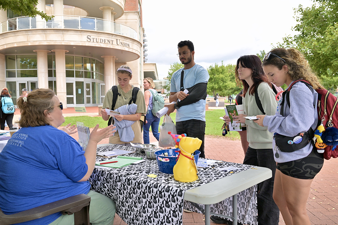 A representative from the Beesley Animal Foundation, left, speaks with Middle Tennessee State University students about volunteer opportunities during the fall Volunteer Fair held Tuesday, Oct. 1, near the Student Union Commons on the MTSU campus in Murfreesboro, Tenn. (MTSU photo by J. Intintoli)