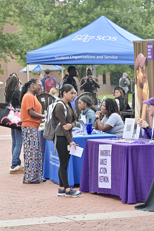 A representative from the Pancreatic Cancer Action Network, right, speaks with a Middle Tennessee State University student about volunteer opportunities during the fall Volunteer Fair held Tuesday, Oct. 1, near the Student Union Commons on the MTSU campus in Murfreesboro, Tenn. The event was coordinated by Student Organizations and Service in the Center for Student Involvement and Leadership. (MTSU photo by J. Intintoli)