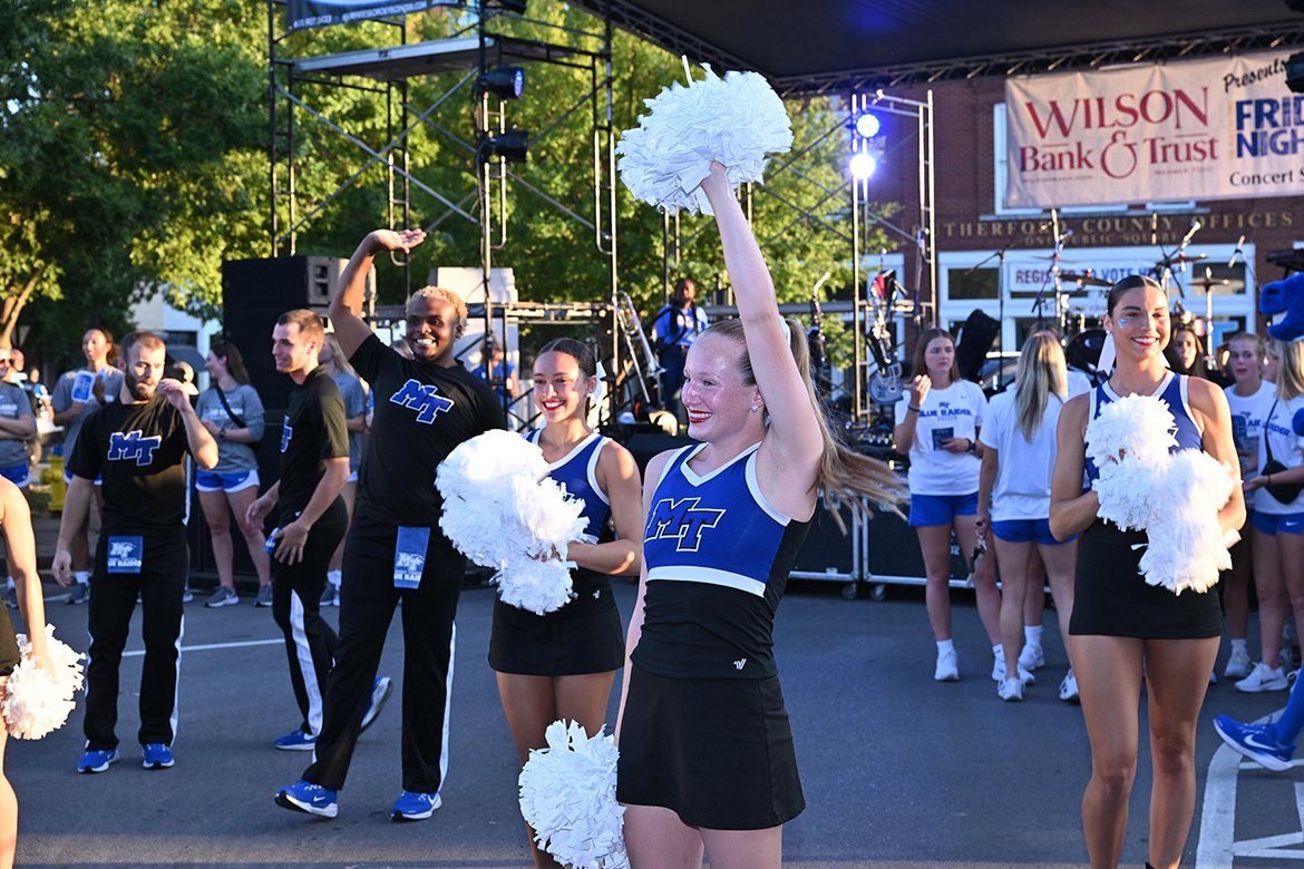 Members of the Middle Tennessee State University Athletics cheerleading squad hype of the crowd at the October Friday Night Live concert in downtown Murfreesboro, Tenn. The event featuring MT Athletics was cosponsored by the university as part of a growing partnership with the Main Street Murfreesboro downtown advocacy organization. (MTSU photo by James Cessna)