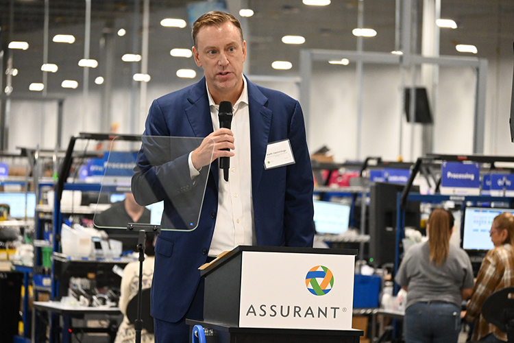 Assurant Inc. President and CEO Keith Demmings addresses the crowd during Assurant’s grand opening and ribbon-cutting held Oct. 10 at its Mt. Juliet, Tenn., facility. As part of the opening, the device care company awarded a $100,000 grant Middle Tennessee State University in support of its mechatronics engineering program and a new lab in the Applied Engineering Building set to open next fall on campus. (MTSU photo by Jimmy Hart)