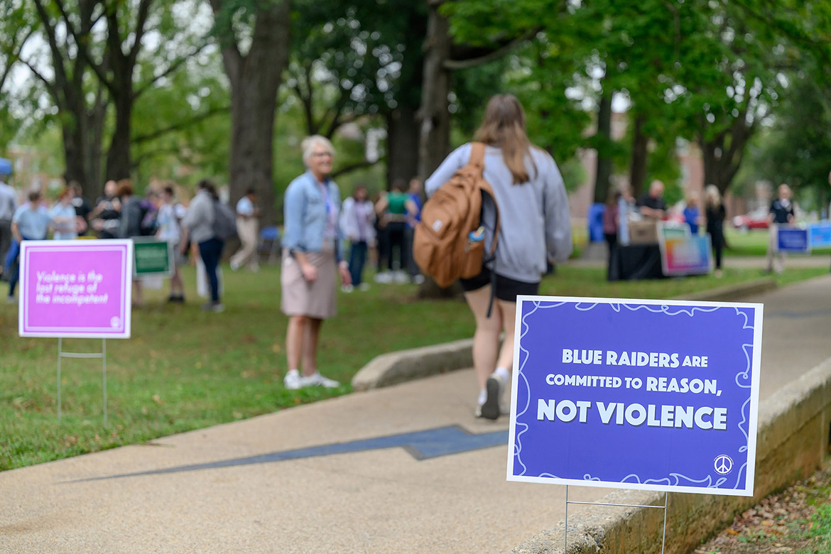 A series of signs such as this greeted attendees to Middle Tennessee State University’s annual International Day of Nonviolence celebration on Wednesday Oct. 2, in Walnut Grove in Murfreesboro, Tenn. The event was held to reaffirm the True Blue Pledge of committing to reason and not violence as well as celebrating the late peace advocate Mahatma Gandhi’s birthday. (MTSU photo by J. Intintoli)