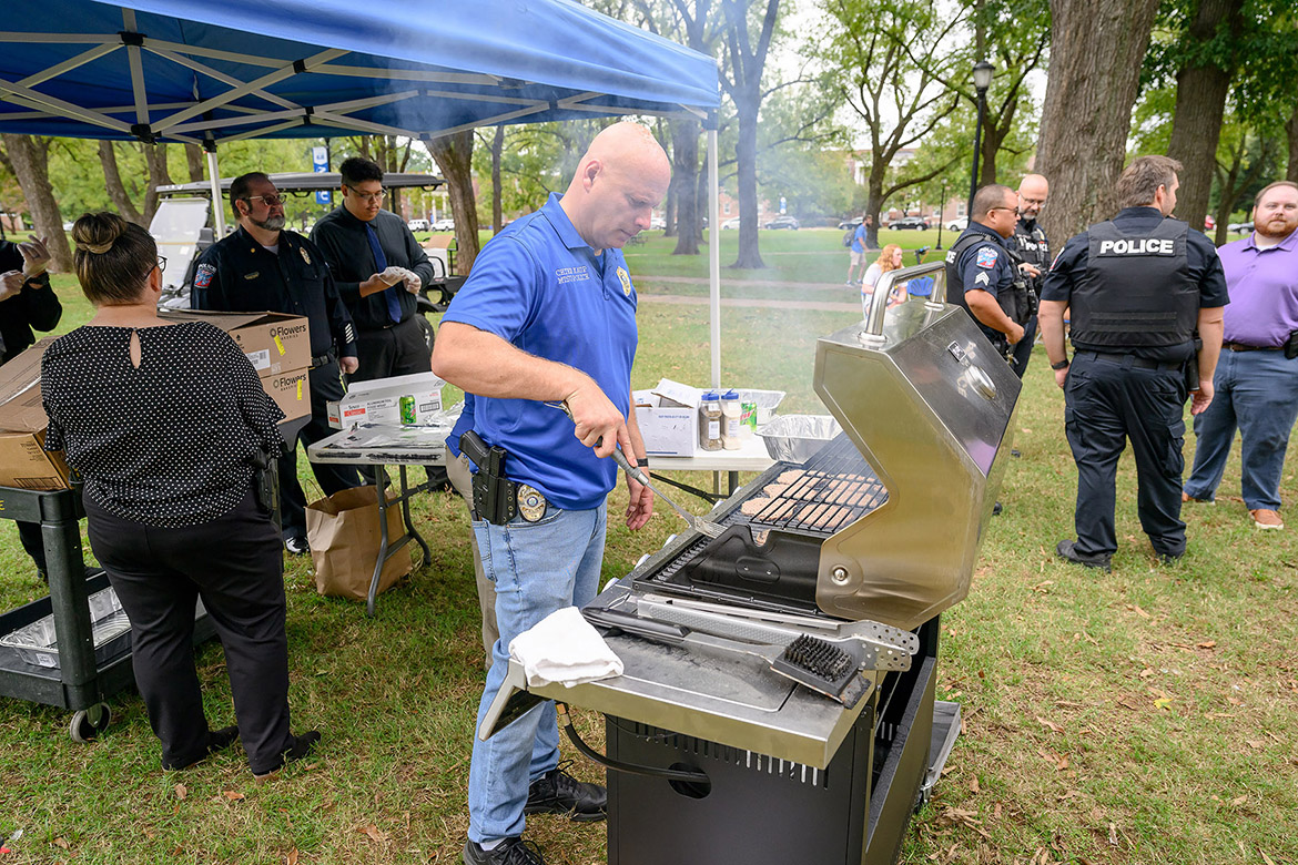 Middle Tennessee State University Police Department’s Chief Edwin “Ed” Kaup grills burgers for students, faculty and staff at the annual International Day of Nonviolence event to reaffirm the True Blue Pledge of committing to reason and not violence as well as celebrating the late peace advocate Mahatma Gandhi’s birthday on Wednesday Oct. 2, in Walnut Grove in Murfreesboro, Tenn. (MTSU photo by J. Intintoli)