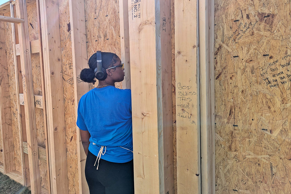 A Middle Tennessee State University student helps put the affirmation filled walls up at the annual Habitat for Humanity panel build on Thursday, Oct. 3, in the Student Union Commons in Murfreesboro, Tenn. (Photo courtesy of Rutherford County Area Habitat for Humanity)