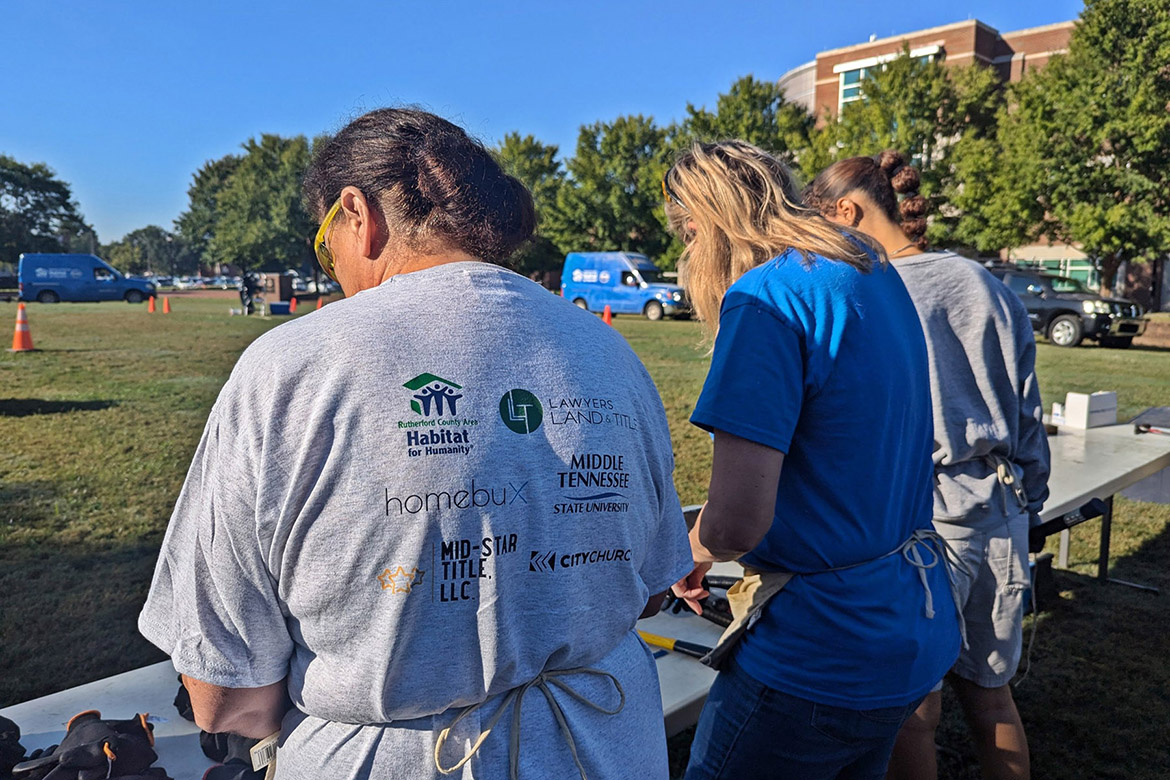 Middle Tennessee State University students and an Exit Realty volunteer display teamwork at the annual Habitat for Humanity panel build on Thursday, Oct. 3, in the Student Union Commons in Murfreesboro, Tenn. (Photo courtesy of Rutherford County Area Habitat for Humanity)