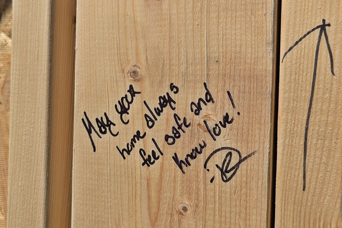 A written affirmation for the future homeowner is shown on one of the walls built by Middle Tennessee State University students, faculty and staff and Exit Realty volunteers at the Habitat for Humanity panel build on Thursday, Oct. 3, in the Student Union Commons in Murfreesboro, Tenn. (Photo courtesy of Rutherford County Area Habitat for Humanity)