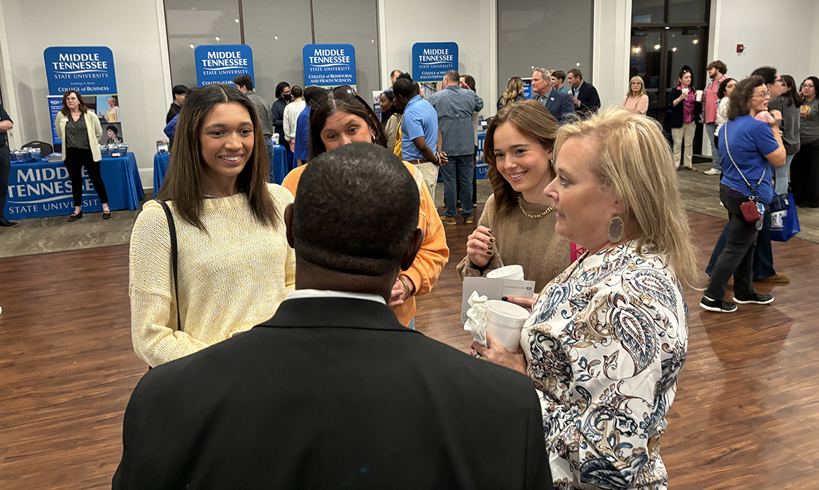 Middle Tennessee State University President Sidney A. McPhee, foreground, speaks with prospective students from South Gibson High School (and their mothers) —Faith Reed, left, Jennifer Bailey Ivy Cianciolo and Lois Cianciolo — Oct. 29 at the MTSU True Blue Tour event at the Jackson Country Club in Jackson, Tenn. (MTSU photo by Randy Weiler)