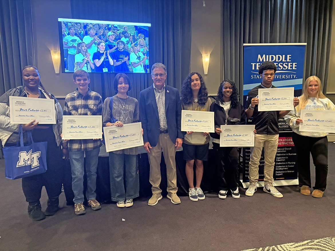 Memphis, Tenn.-area prospective students, whose names were drawn for scholarships, are shown with Middle Tennessee State University Provost Mark Byrnes, center, on Monday, Oct. 28, during the MTSU True Blue Tour visit at the Esplande Memphis event venue in Cordova, Tenn. MTSU awarded $18,000 in scholarships. (MTSU photo by Randy Weiler)