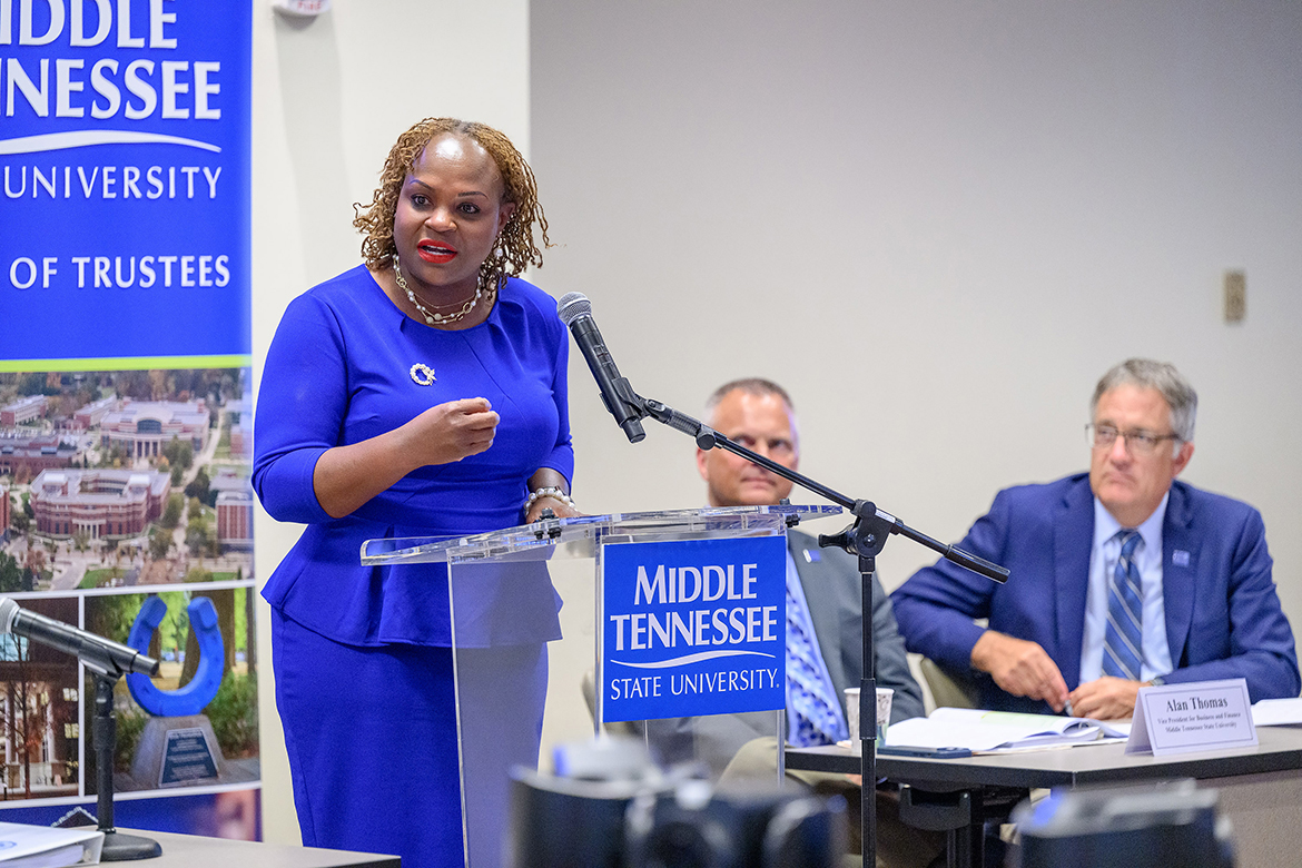 With Vice President of Business and Finance Alan Thomas, second from left, and Provost Mark Byrnes looking on, Khalilah Doss, left, addresses members of the Middle Tennessee State University Board of Trustees in early June following her appointment as vice president of student affairs and dean of students during their meeting at the Miller Education Center on Bell Street in Murfreesboro, Tenn.  Doss, a Kingston, Jamaica, native who came to MTSU from the University of Southern Indiana in Evansville, was recommended to the board by university President Sidney A. McPhee. (MTSU photo by J. Intintoli)