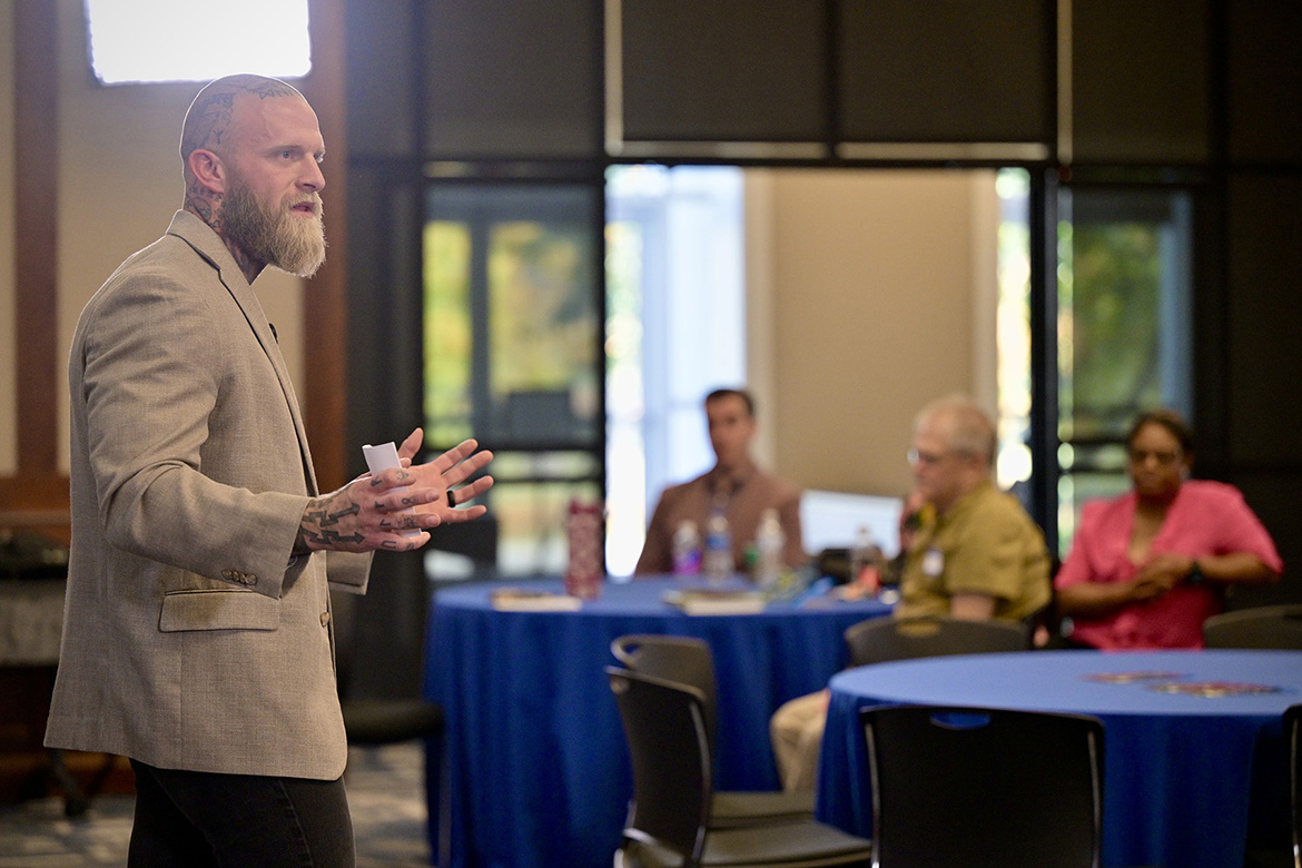 Joe Adams, a military veteran, MTSU psychology graduate student and founder of the Relentless Pursuit company, speaks about his journey of overcoming addiction and grappling with mental health issues at the Middle Tennessee State University National Disability Employment Awareness Month conference Oct. 29 in the Sam H. Ingram Building on campus in Murfreesboro, Tenn. (MTSU photo by J. Intintoli)