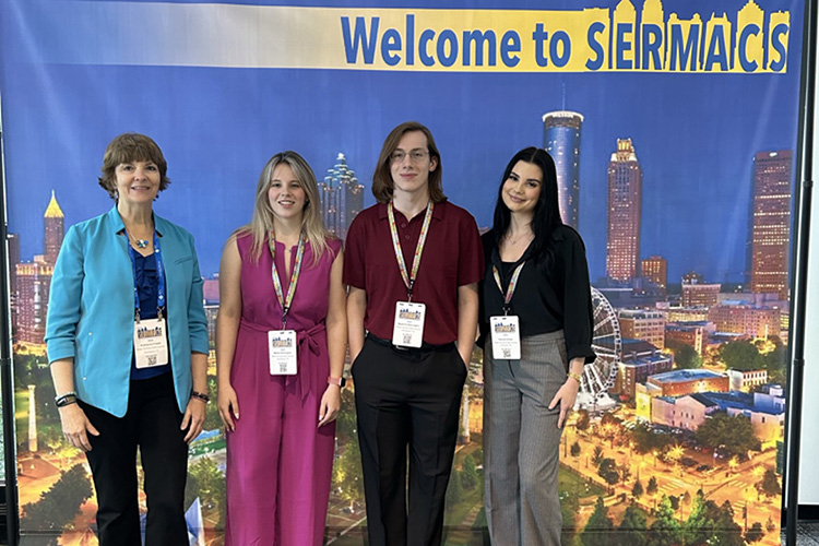 From left, Middle Tennessee State University chemistry professor and principal investigator of the Scholarships for STEM, better known as S-STEM, program Andrienne Friedli poses with National Science Foundation grant-supported students Meleia Wolvington, Austin Wolvington and Hannah Butler at the Southeastern Regional Meeting of the American Chemical Society in Atlanta where they presented their research as part of the program. (Photo submitted)