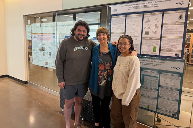 Andrienne Friedli, Middle Tennessee State University chemistry professor and principal investigator of the Scholarships for STEM, better known as S-STEM, program poses with students Aldair Avalos-Madera, left, and Mia Bush, right in the Science Building on campus in Murfreesboro, Tenn. Both students are supported with S-STEM scholarships as well as paid summer research and travel opportunities funded by the National Science Foundation grant. (Photo submitted)