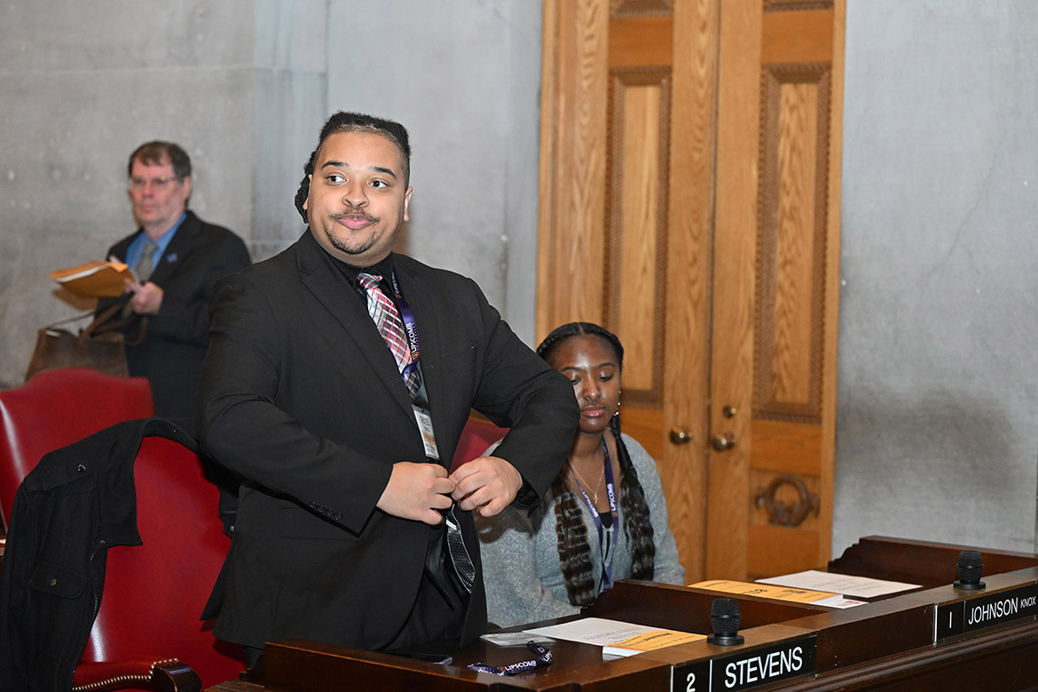 Middle Tennessee State University student Denzel Harris, the university’s head student delegate to this year’s Tennessee Intercollegiate State Legislature, or TISL, stands to represent MTSU at the opening ceremony of the event on Nov. 21 on the floor of the state House of Representatives at the Tennessee Capitol in Nashville, Tenn. (MTSU photo by James Cessna)