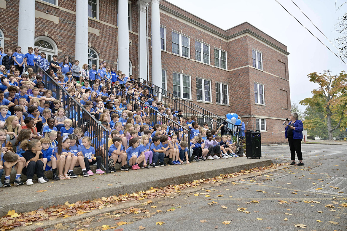 Rita King, president of Friends of Campus School, the school’s support group and primary organizer of the event, gives remarks to Homer Pittard Campus School students at the unveiling of the two “Whorley Way” street signs situated at each end of the school’s driveway, honoring former principal and first grade teacher Liz Whorley Bradley, at Homer Pittard Campus School in Murfreesboro, Tenn. Middle Tennessee State University partnered with Friends of Campus School and Rutherford County Schools to plan and implement the street signs. (MTSU photo by Andy Heidt)