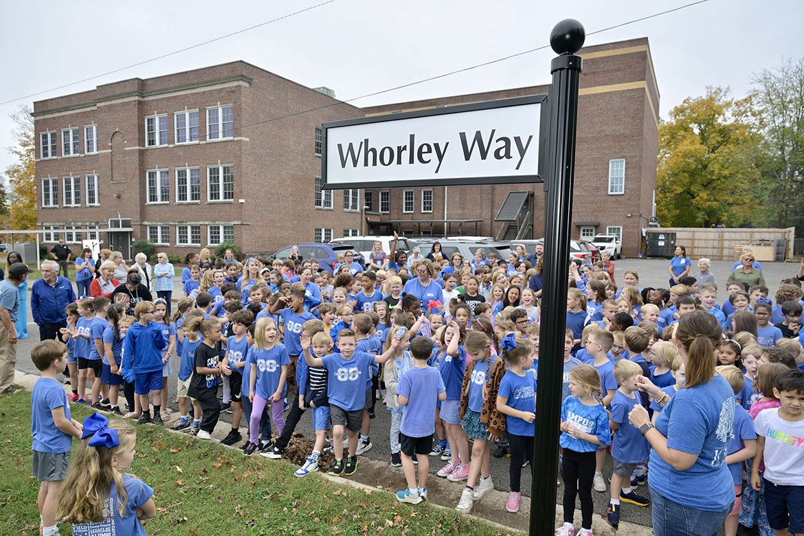 Homer Pittard Campus School students cheer after the “Whorley Way” street sign near Burton Street, one of the school’s entrances, was unveiled to commemorate former principal and first grade teacher Liz Whorley Bradley in Murfreesboro Tenn. Middle Tennessee State University partnered with Friends of Campus School and Rutherford County Schools to plan and implement the street signs. (MTSU photo by Andy Heidt)