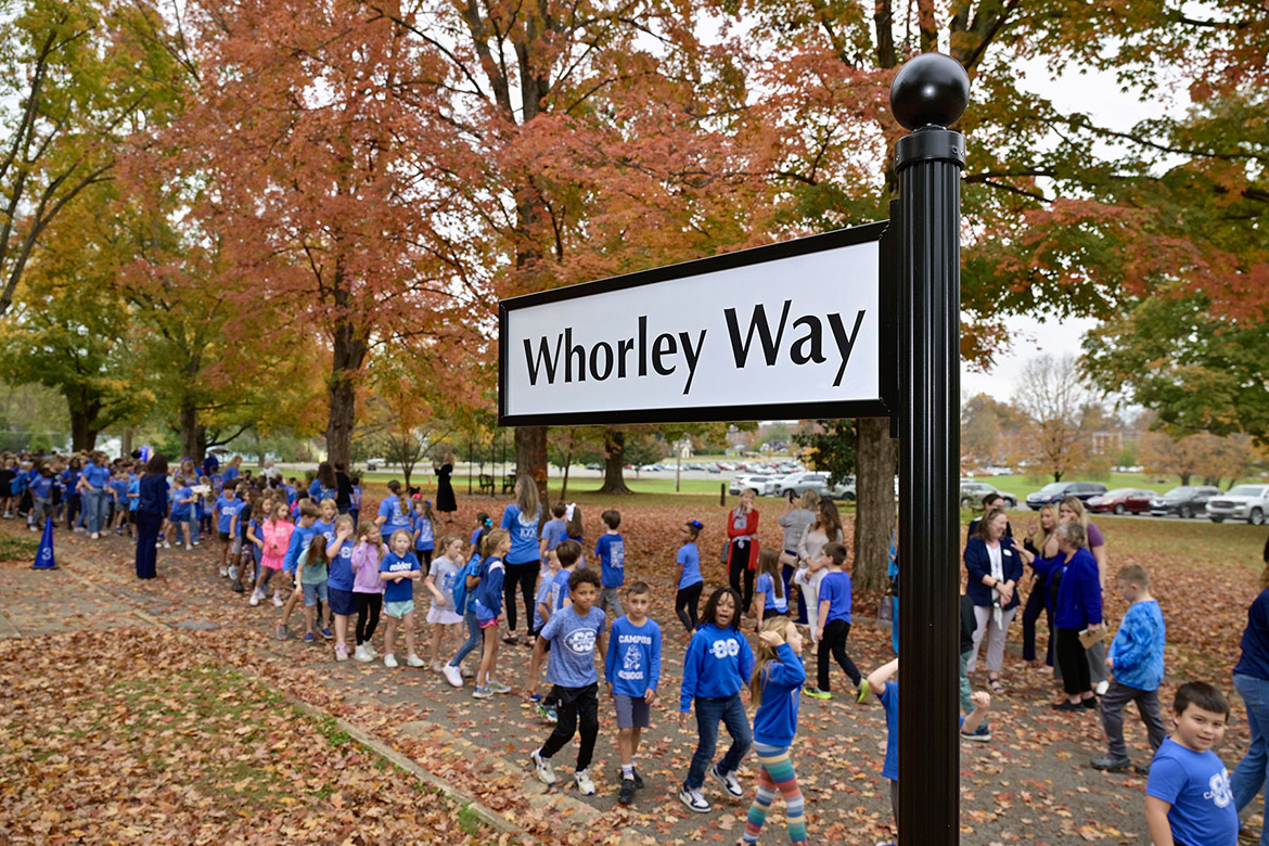 Homer Pittard Campus School students chant, “Whorley Way, look both ways. Whorley Way, let’s be safe,” as they march towards the recently revealed street sign near Lytle Street, one of the school’s entrances, celebrating former principal and first grade teacher Liz Whorley Bradley in Murfreesboro Tenn. Middle Tennessee State University partnered with Friends of Campus School and Rutherford County Schools to plan and implement the street signs. (MTSU photo by Andy Heidt)