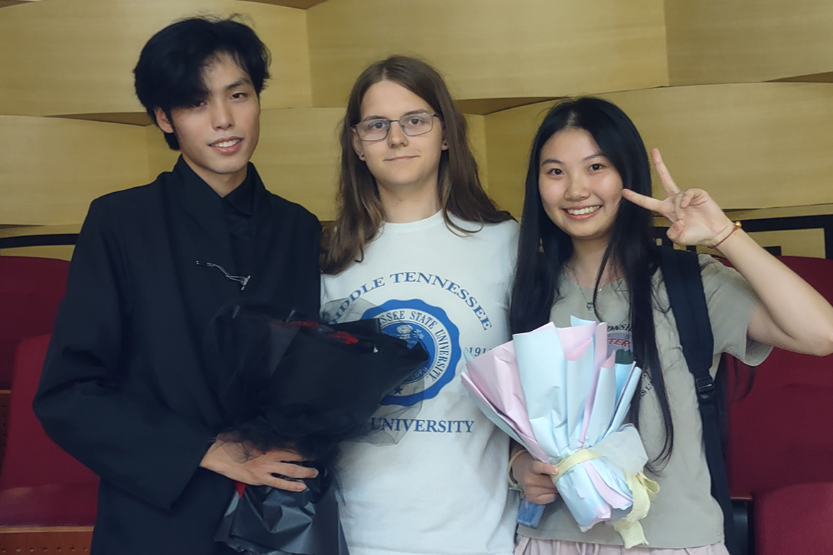 William Sprayberry, center, a Chinese Music Ensemble member at Middle Tennessee State University in Murfreesboro, Tenn., stands with two Chinese students following a concert in Xiamen, China, over the summer. (Submitted photo)