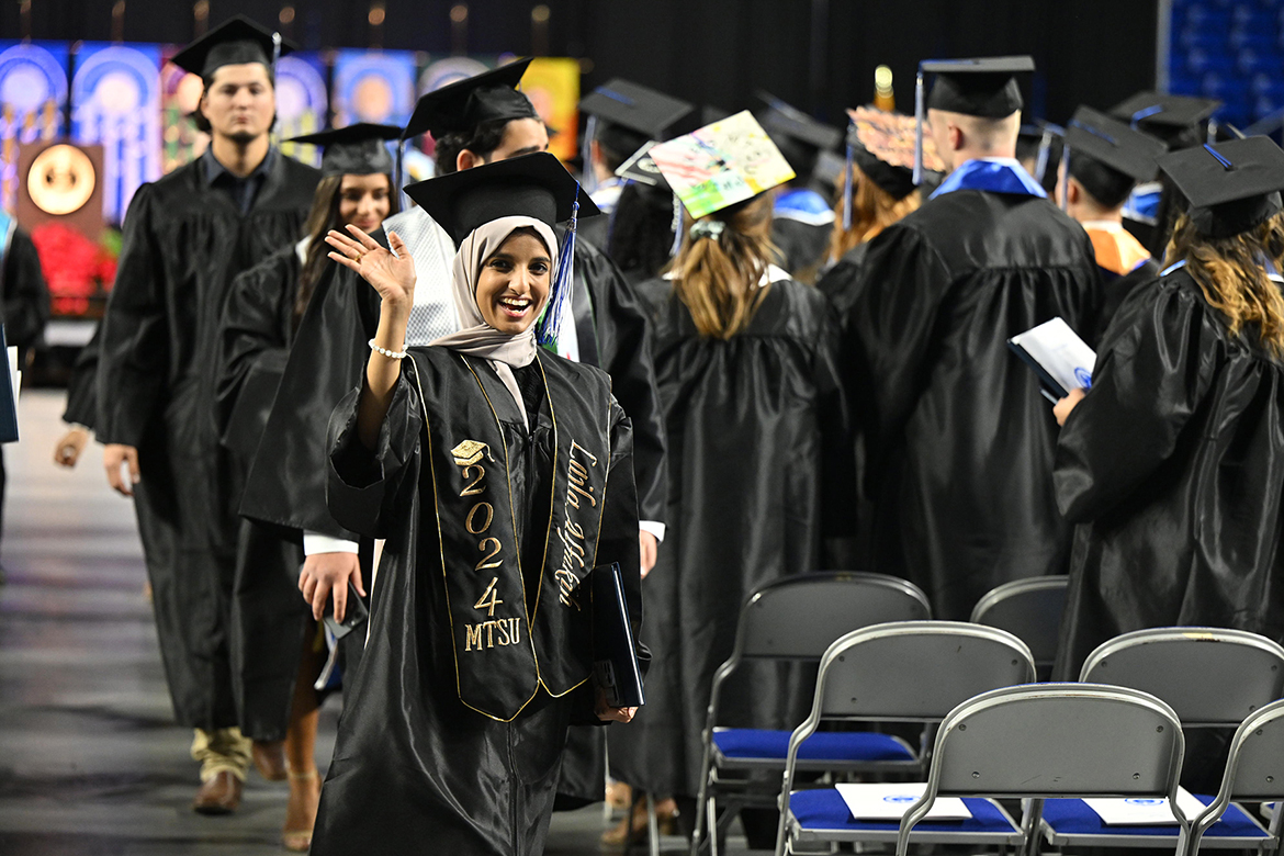 Middle Tennessee State University information systems major Laila Alfakih celebrates her recently obtained degree during the afternoon commencement ceremony held for the fall graduating Class of 2024 on Saturday, Dec. 14, inside Murphy Center on campus in Murfreesboro, Tenn. MTSU presented nearly 1,600 degrees to undergrad and graduate students during morning and afternoon ceremonies. (MTSU photo by Andy Heidt)