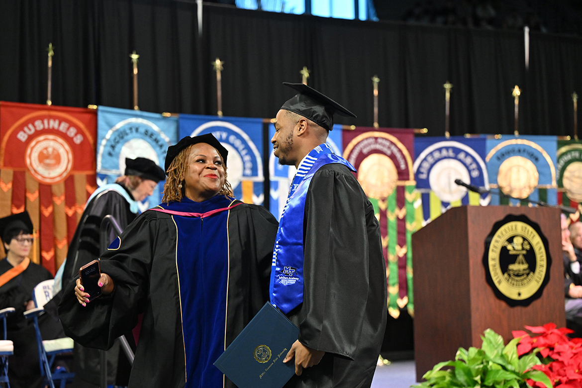 Middle Tennessee State University Vice President of Student Affairs and Dean of Students Khalilah Doss congratulates a graduate in the fall Class of 2024 during the morning commencement ceremony held Saturday, Dec. 14, inside Murphy Center on campus in Murfreesboro, Tenn. MTSU presented nearly 1,600 degrees to undergrad and graduate students during two ceremonies. (MTSU photo by Cat Curtis Murphy)