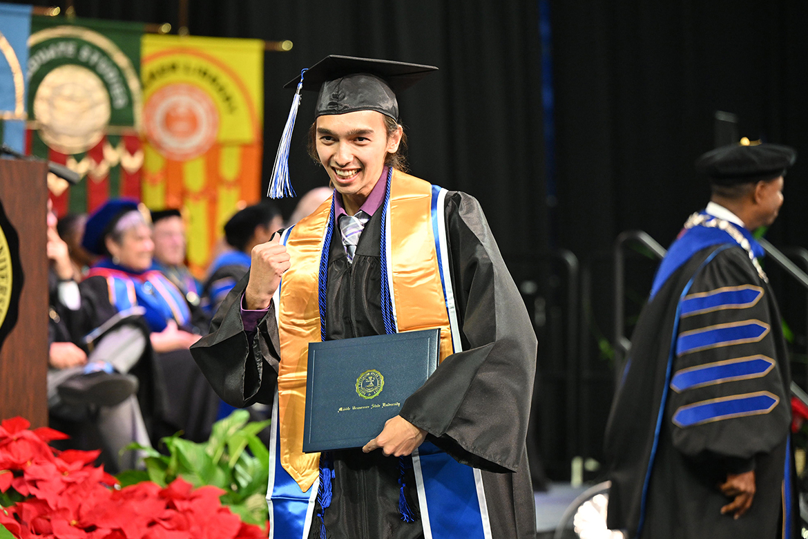 A Middle Tennessee State University student does a fist pump as he celebrates his newly obtained degree during the afternoon commencement ceremony held Saturday, Dec. 14, in Murphy Center on the MTSU campus in Murfreesboro, Tenn., for the fall graduating Class of 2024. Nearly 1,600 graduates received their degrees. (MTSU photo by Andy Heidt)