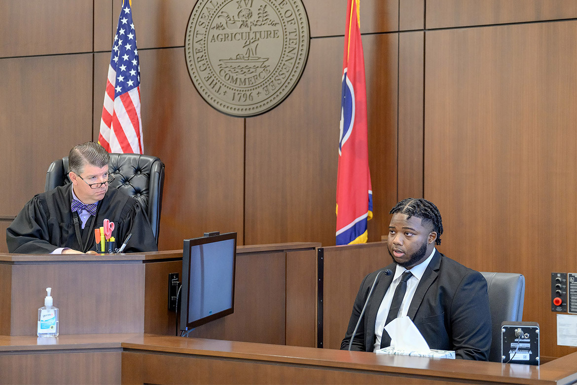 Jaylon Jefferson, a forensic science major at Middle Tennessee State University in Murfreesboro, Tenn., speaks to the court as he explains details about a case he crafted for participation in a mock trial as part of his senior seminar project as Circuit Court Judge Barry Tidwell listens. (MTSU photo by J. Intintoli)