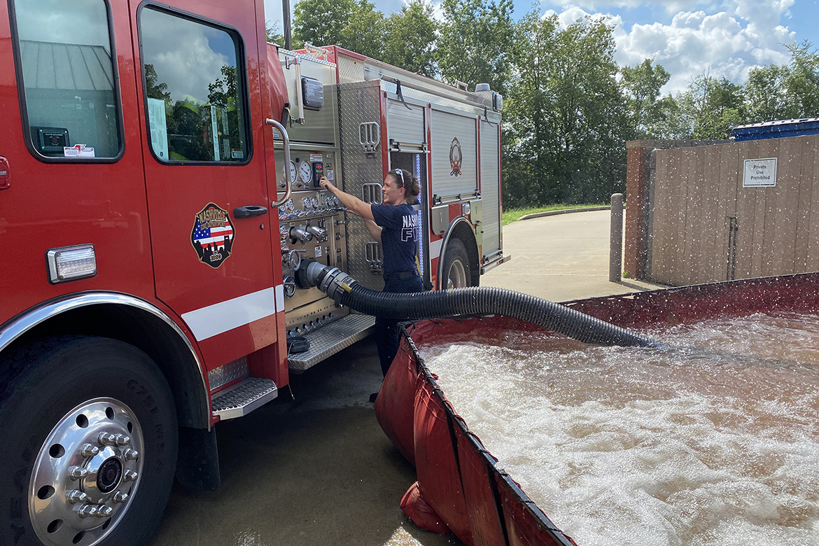 In this undated photo, former Nashville, Tenn., firefighter Heather Zimmerman is shown outside one of the department’s engines at the Nashville Fire Training Academy. Now executive director of the state’s fightfighting commission, Zimmerman will soon graduate from Middle Tennessee State University in Murfreesboro with her bachelor’s degree after returning to the classroom to study public safety. (Submitted photo)