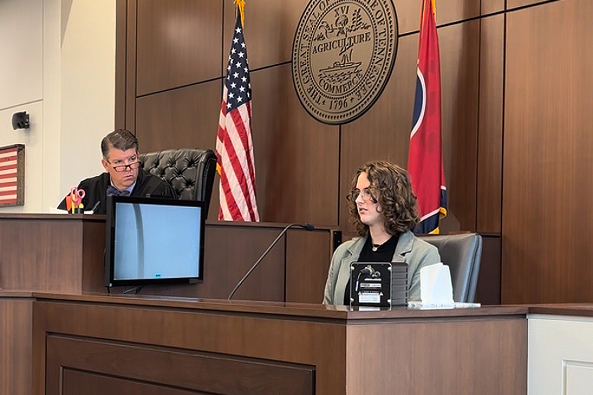 Katherine Smeltz, a senior forensic science major at Middle Tennessee State University in Murfreesboro, Tenn., answers questions on the stand during a mock trial she participated in as a class project while Circuit Court Judge Barry Tidwell listens. (MTSU photo by Nancy DeGennaro)