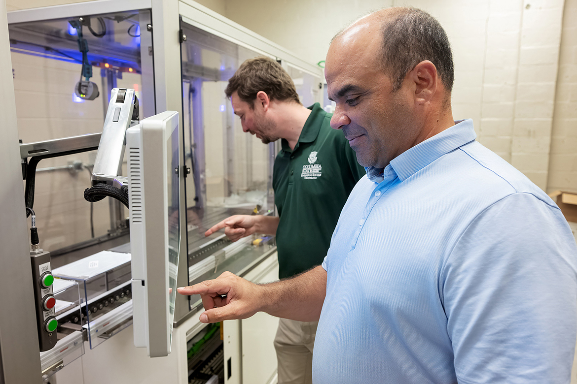 Columbia State Community College adjunct faculty member Daniel Garrett, left, and Middle Tennessee State University Engineering Technology associate professor Jorge Vargas check out relatively new Flex Space robotics equipment in an MTSU lab earlier this year on campus in Murfreesboro, Tenn. Columbia State and MTSU are utilizing a three-year, nearly $350,000 National Science Foundation grant to aid in certifying future technicians and engineers in robotics and automation systems in the Midstate. (MTSU photo by Andy Heidt)