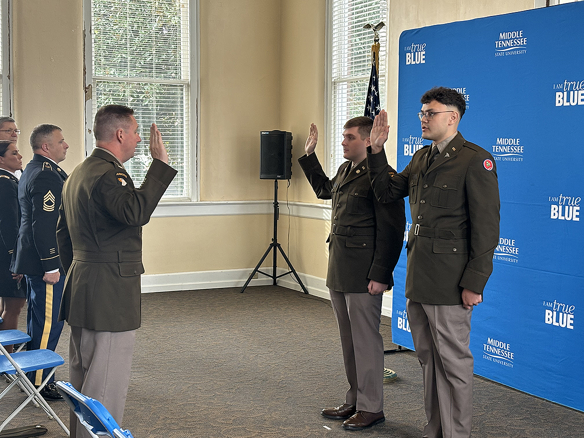 U.S. Army Lt. Col. Arlin Wilsher, left, administers the Army oath to former Middle Tennessee State University ROTC cadets Alexander Hagerman, second from left, of Nashville, Tenn., and David Nevarez of Murfreesboro, Tenn., during the commissioning ceremony held for them Friday, Dec. 13, in the Tom H. Jackson Building’s Cantrell Hall on the MTSU campus in Murfreesboro. They graduated Dec. 14 during commencement ceremonies in Murphy Center. (MTSU photo by Randy Weiler)