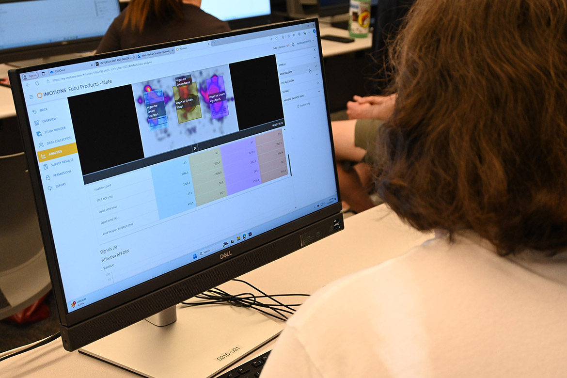 Middle Tennessee State University student Nate Sosville uses the iMotion Online for Education artificial intelligence, or AI, software to analyze eye-tracking data from his group’s study in the neuromarketing class of Gaia Rancati, assistant professor of marketing, in the Business and Aerospace Building on campus in Murfreesboro, Tenn. (MTSU photo by Maddy Williams)