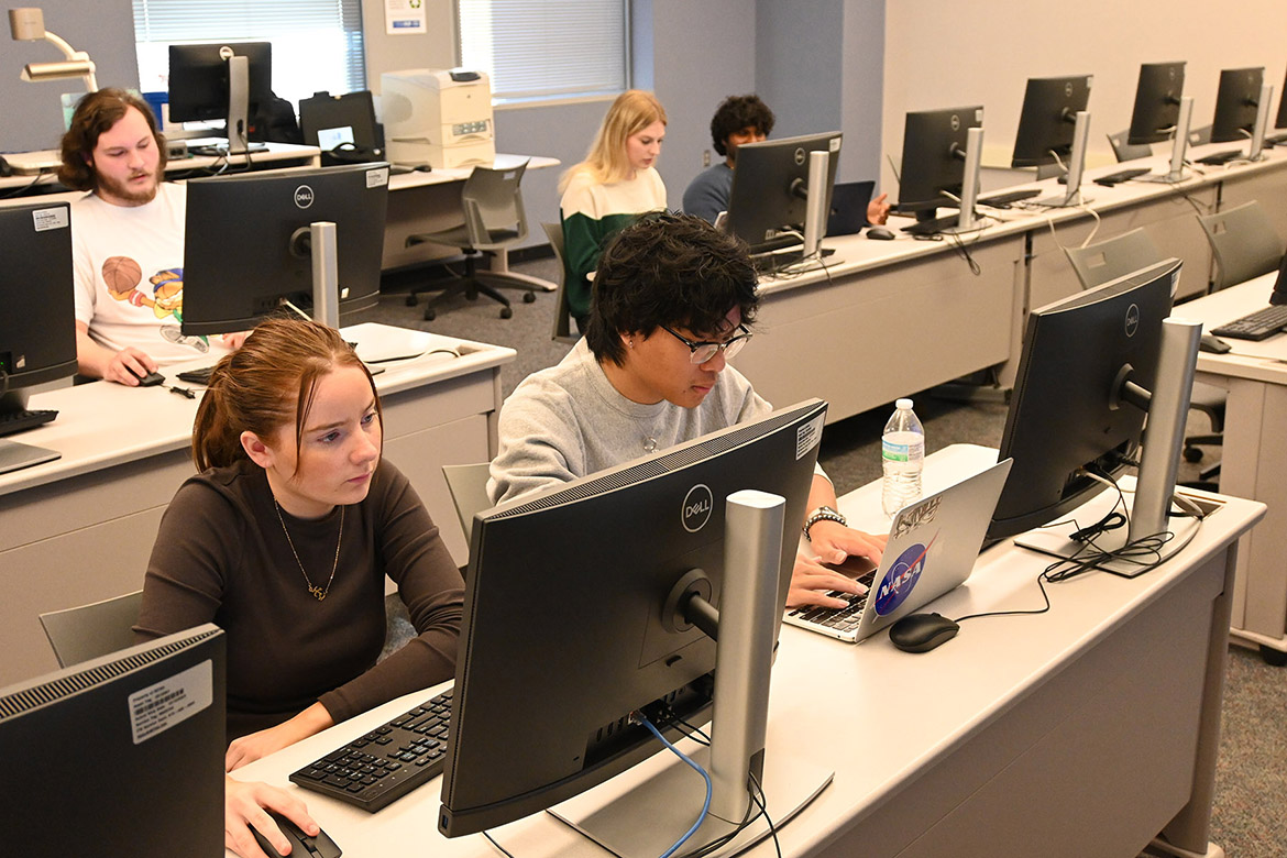 Middle Tennessee State University students work on their group studies using the iMotion Online for Education artificial intelligence, or AI, software in the neuromarketing class of Gaia Rancati, assistant professor of marketing, in the Business and Aerospace Building on campus in Murfreesboro, Tenn. (MTSU photo by Maddy Williams)