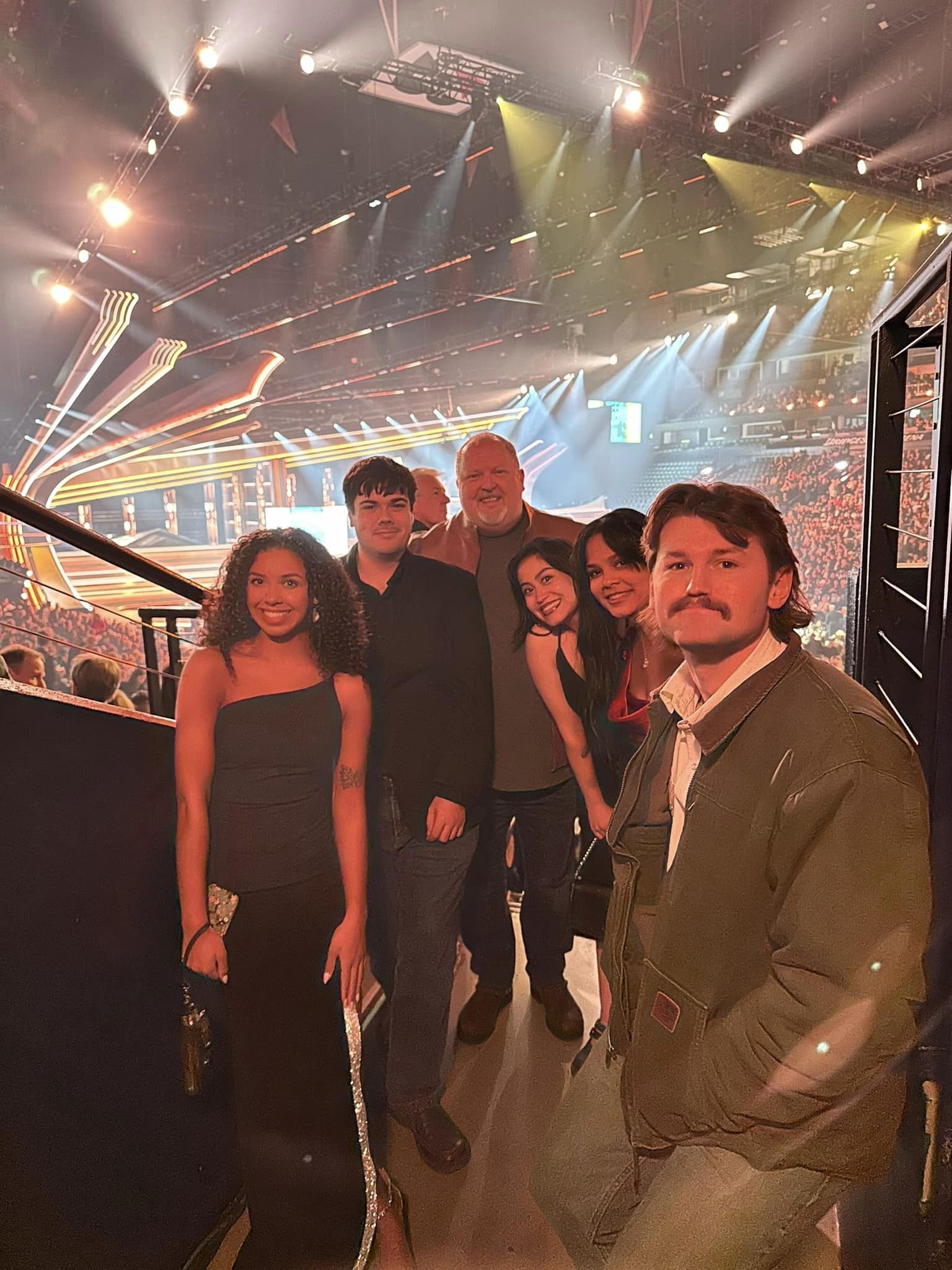 Department of Recording Industry professor Odie Blackmon poses with six of his students at the 58th annual CMA Awards at the Bridgestone Arena in downtown Nashville on Wednesday, Nov. 20, 2024, thanks to a partnership with the Country Music Association. (Photo submitted)