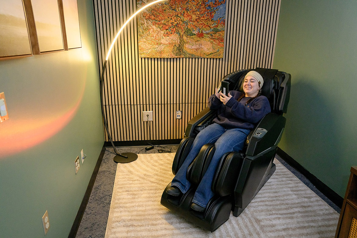 A Middle Tennessee State University student uses one of the massage chairs in the recently launched Relaxation Station inside Health Services in the Health, Wellness and Recreation Center in Murfreesboro, Tenn. Interior architecture seniors designed the space to give students a place on campus to relax and recharge. (MTSU photo by J. Intintoli)