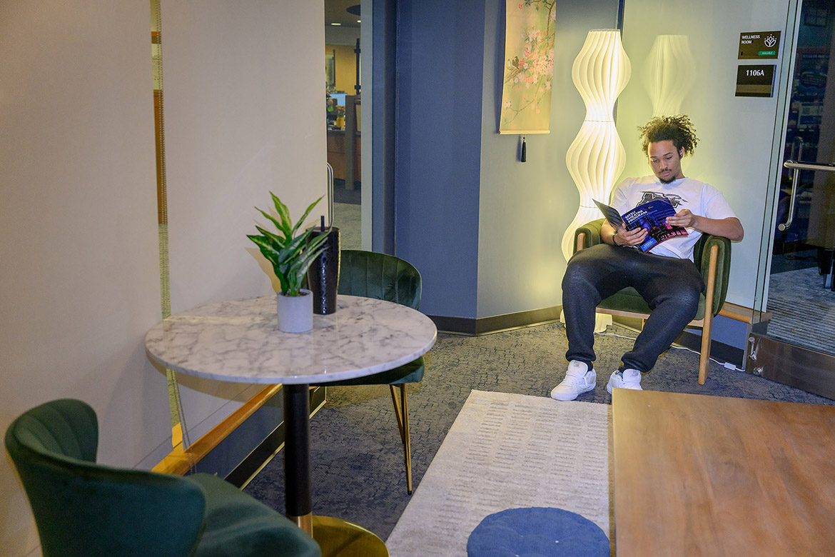 A Middle Tennessee State University student reads a magazine in the recently launched Relaxation Station, which was designed by interior architecture seniors to give students a place on campus to recharge, inside Health Services in the Health, Wellness and Recreation Center in Murfreesboro, Tenn. (MTSU photo by J. Intintoli)