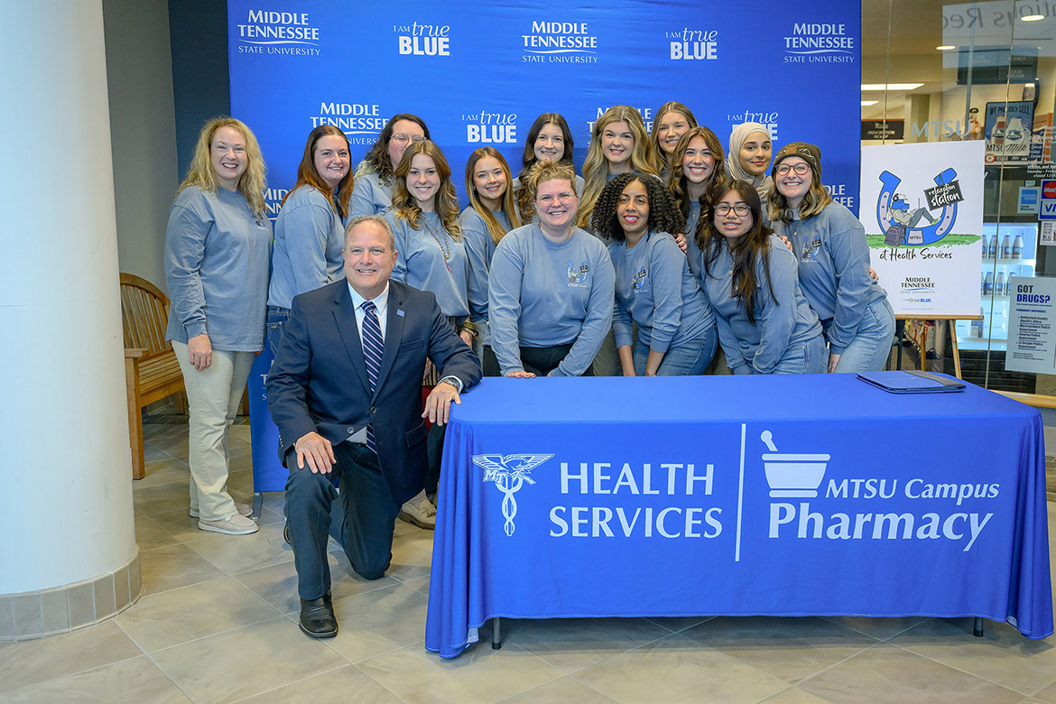 Middle Tennessee State University interior architecture lecturer Paula Harnack poses for a group photo with her interior architecture senior class and Peter Grandjean, dean of the College of Behavioral and Health Sciences, at the open house of the new Relaxation Station, which was designed by interior architecture seniors to provide students with a place on campus to recharge, in the Health, Wellness and Recreation Center atrium in Murfreesboro, Tenn. (MTSU photo by J. Intintoli)