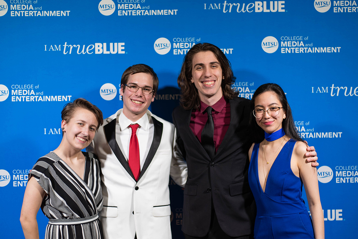 From left to right, “All One” student directors Skye Baxter, Cooper Rogers, Seth Savage and Stacey Marie Joan Teves pose for a photo at the premiere of the first original film from MT Imagine Animation Studios on Dec. 12 inside the Student Union Ballroom. (Photo by MTSU student Cynthia Maravilla)